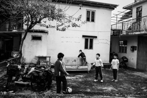 Children and a makeshift soccer pitch.